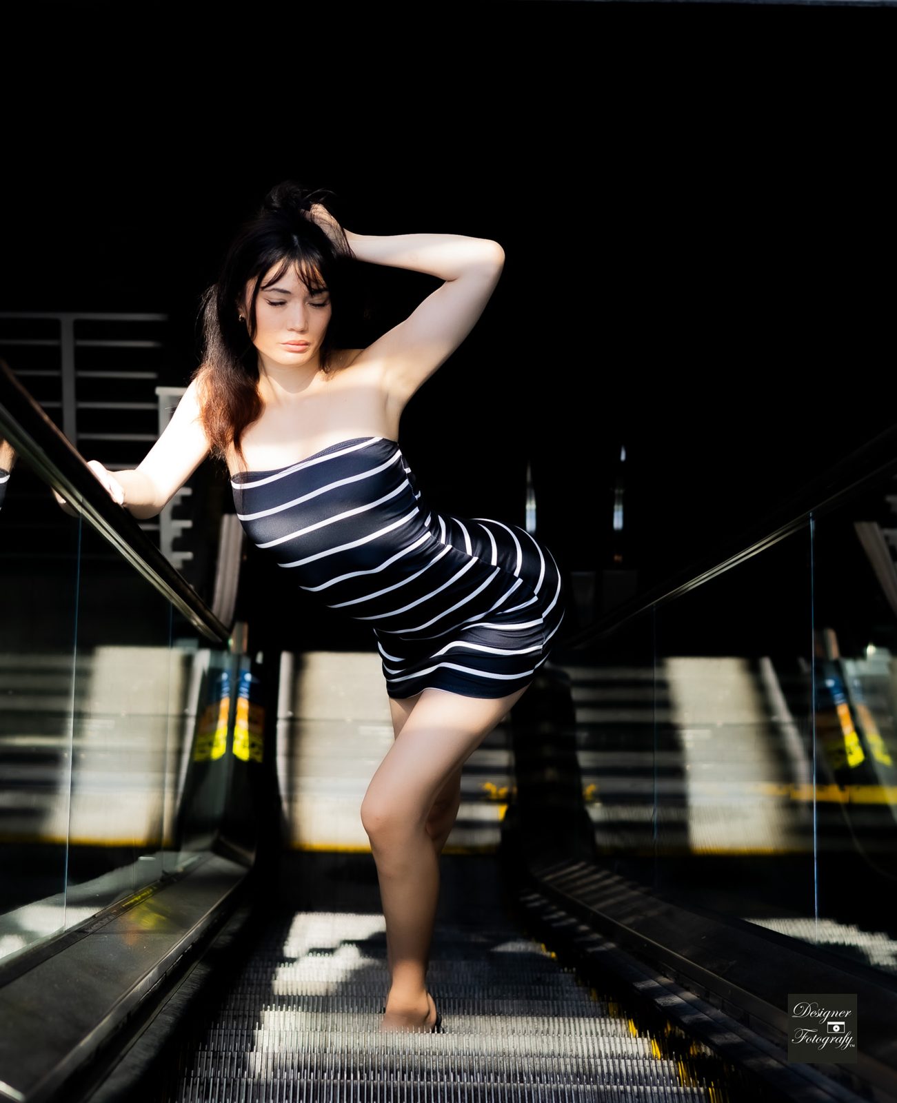 Editorial pose on an escalator